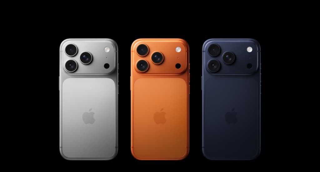 iPhone lineup in silver, orange, and navy
